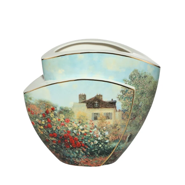A porcelain vase featuring floral and house designs.