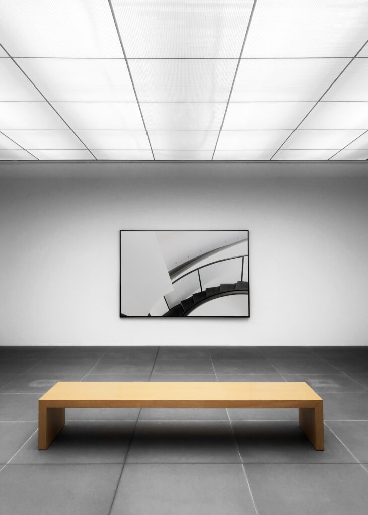 An aesthetic wooden chair and a wall painting