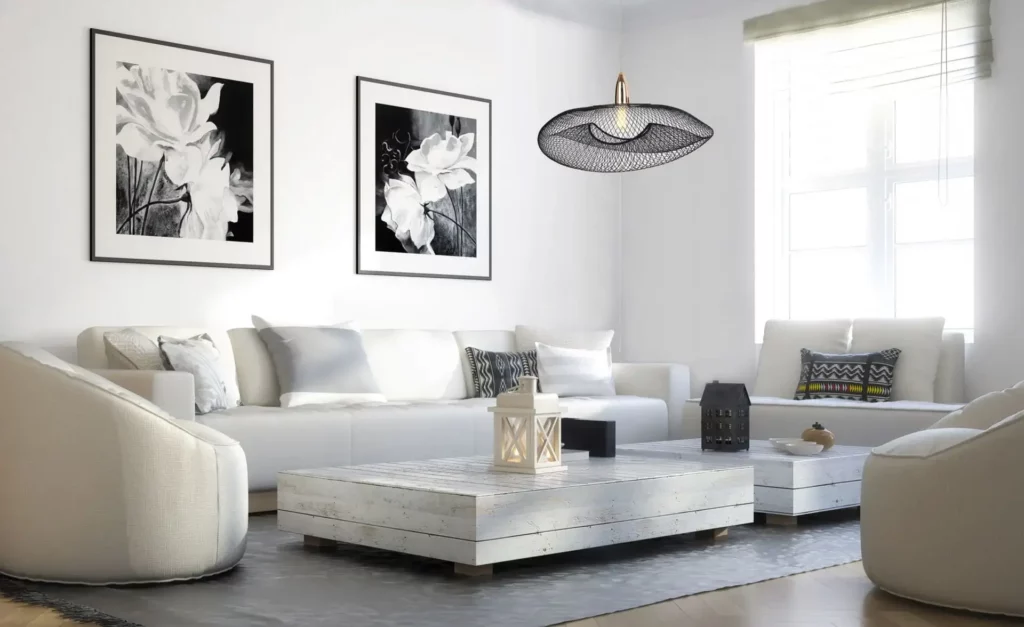 Une scène de vie avec une palette de couleurs blanche et noire et un éclairage suspendu aérien comme éclairage d'appoint.