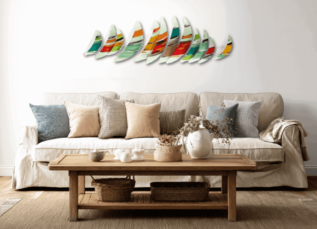 Metal-wall-art-and-a-couch-with-neautral-color-throw-pillows